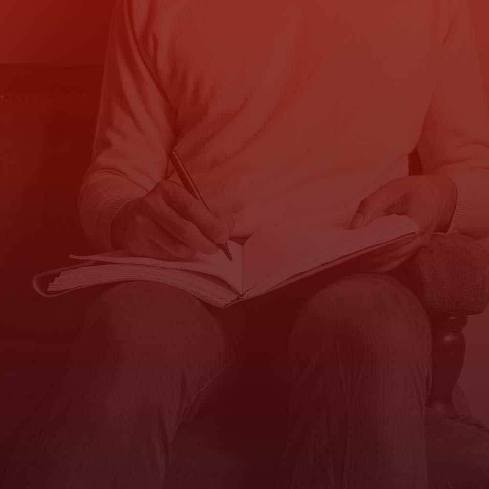 D&D Player using a D&D Character Journal 